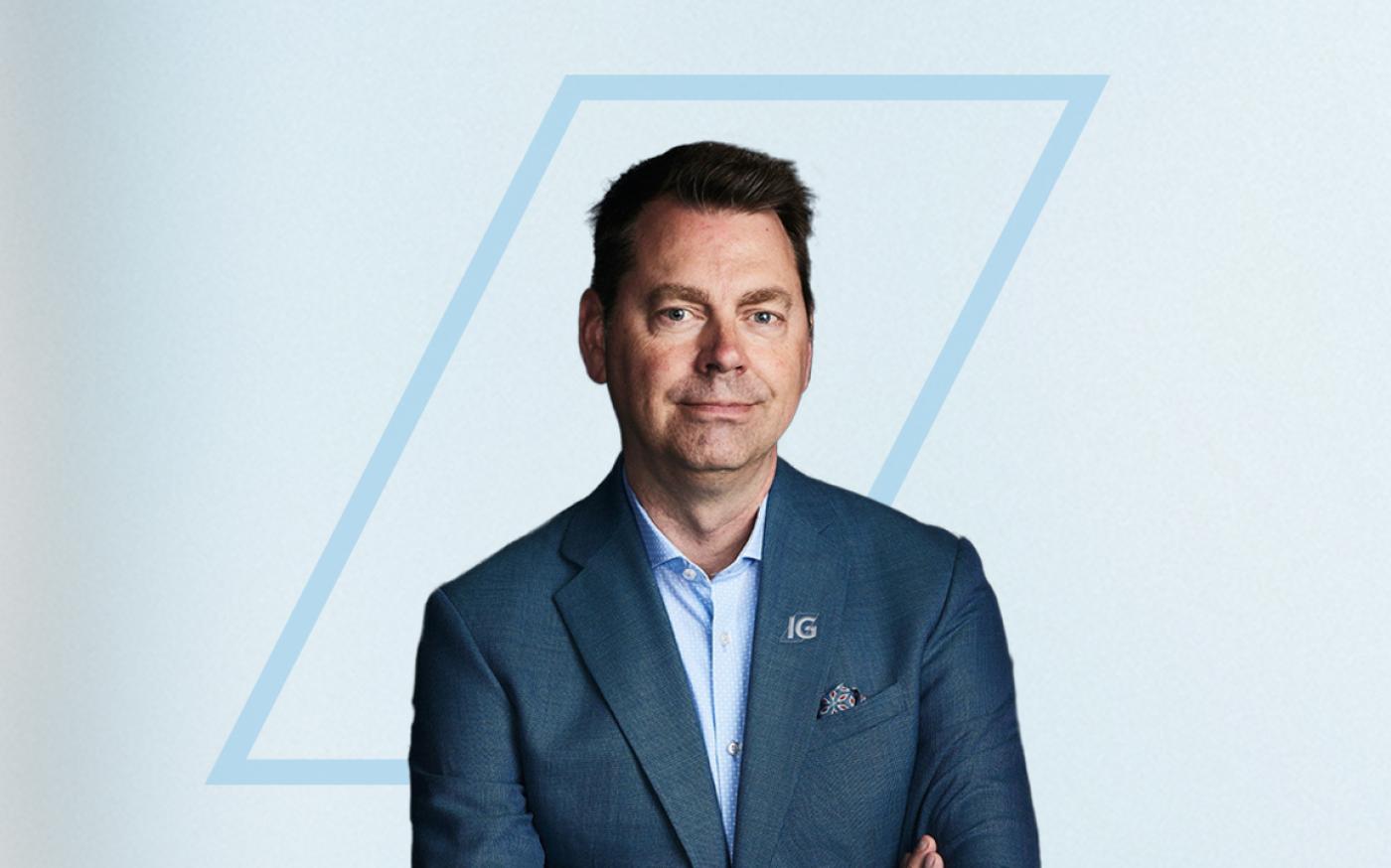 Person posing for a photo with their arms crossed