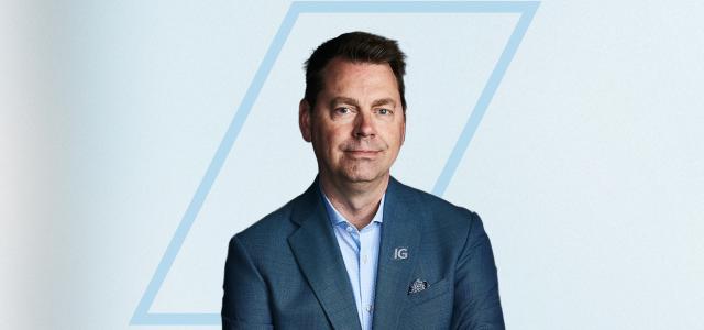 Person posing for a photo with their arms crossed