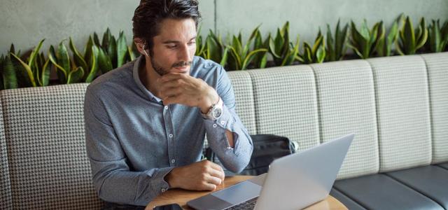 man-at-coffeshop-with-laptop